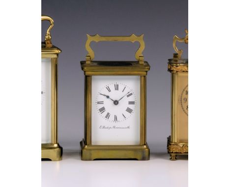 A gilt brass carriage clock timepiece by Duverdry & Bloquel, c.1900, with corniche case with shaped handle, white Roman ename