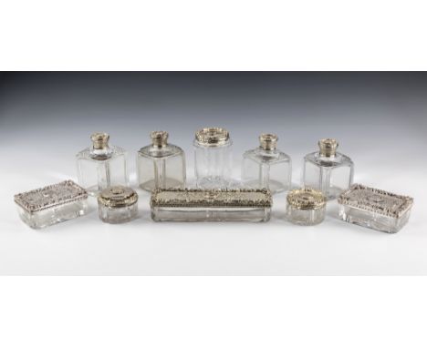 A William IV silver and cut glass toilette set, T. Dexter, London 1831, comprising three rectangular cut glass boxes, the ela