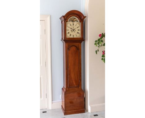 A late George III provincial mahogany striking longcase clock, the arched lantern with arched glazed door flanked by slender 