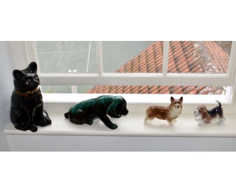 A Royal Copenhagen 564 Beagle Puppy figure, together with a Beswick style figure of a Corgi; a Poole style dog; and a seated 