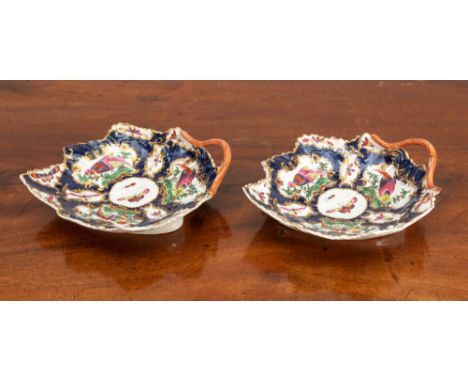 A pair of Worcester first period blue ground leaf dishes, Dr. Wall porcelain moulded, each with gilt rim and orange stick han