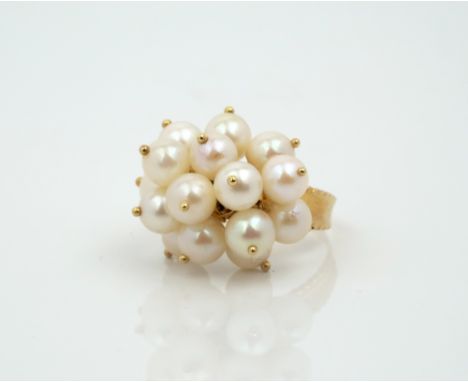 An 18ct gold and cultured pearl trembleuse cluster ring, set with a floral style cluster of fifteen cultured pearls, on a con