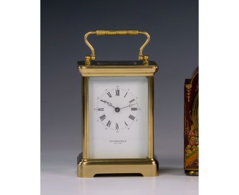 An English brass cased carriage clock, the twin train movement by Taylor & Bligh with a bell strike, the enamel dial with Rom