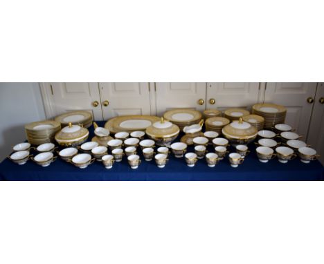 An extensive Minton Porcelain Ball pattern part dinner service, white with gilt decoration, comprising two 16½in. platters; o