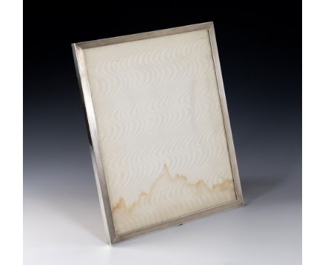 A large Elizabeth II silver rectangular photo frame, by Garrard & Co., London 1954, engine turned decoration, easel back, 13 