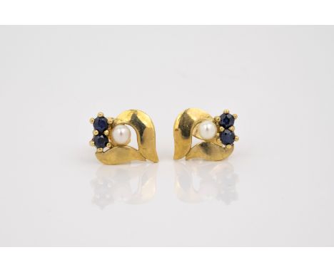 A pair of 9ct gold, sapphire and pearl stud earrings, floral form, each set with two round cut sapphires and a single seed pe