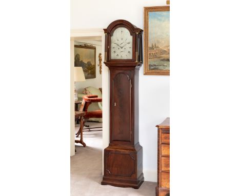 A George III mahogany striking longcase clock, the arched lantern with moulded cornice and arched glazed door within brass mo