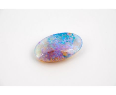 A loose cabochon boulder opal, the oval stone, 13 x 7.5mm., of good fire and colour, with blue, green and violet hues.