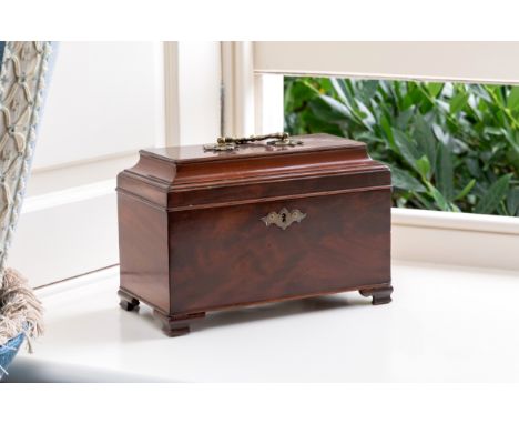 A George III mahogany tea caddy, sarcophagus form, vacant interior, 10¼ x 5¼in. (26 x 13.3cm.).