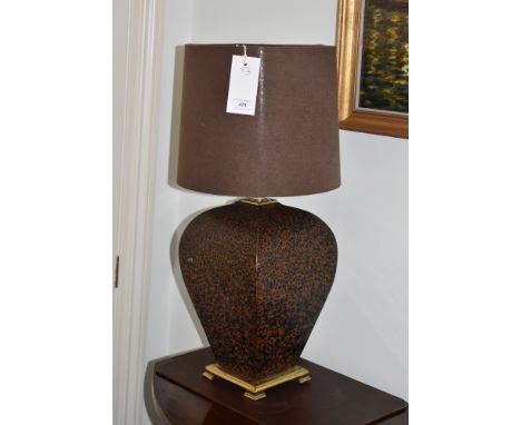 A pair of Oriental vase style lamps, baluster form with iron red glaze, on gilt brass bases, 15in. (38cm.) high plus fittings
