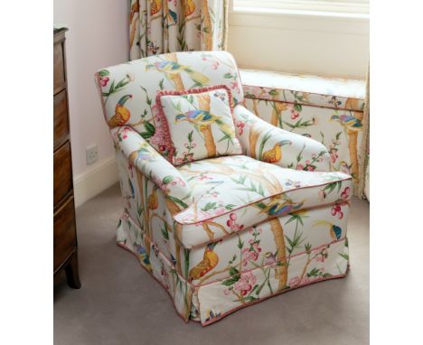A Howard Chairs Ltd. pouffe or stool, in exotic bird upholstery, with stained beech legs and brass castors, stamped 'HOWARD C