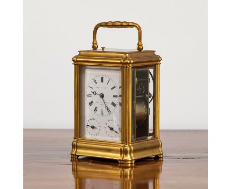 A French gilt brass striking and repeating carriage clock, in gorge case, the top with repeat button, the white enamel dial s