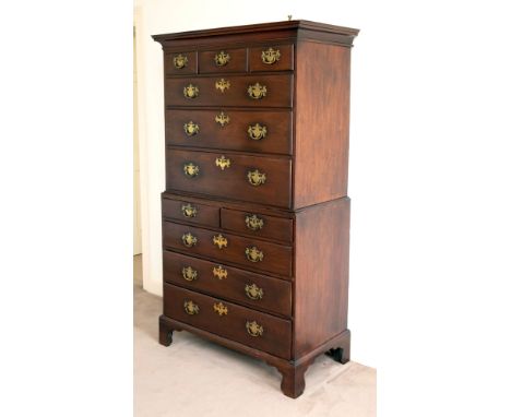 A late George II mahogany tallboy of small proportions, with small cavetto moulded cornice and plain frieze, the upper sectio