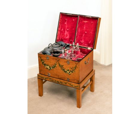 A George III painted satinwood travelling case, the banded top with two oval panels painted with classical female figures, th