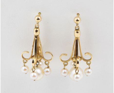 A pair of 9ct gold and clutured pearl chandelier earrings, with stud fittings, the drops with four scroll arms, each suspendi