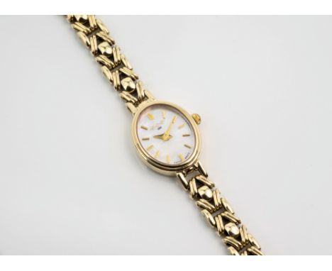 A ladies 9ct gold WHW Ltd. wrist watch, the oval mother-of-pearl dial signed 'WHW 1860 SWISS MOV'T', with gilt baton marks an