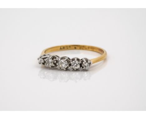 An 18ct yellow gold, platinum and diamond five stone ring, with five graduated brilliant cut diamonds, ring size P½.