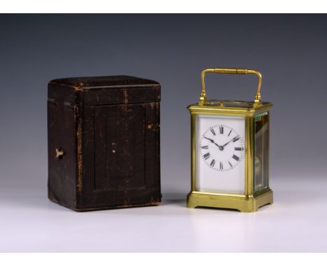 A 19th Century brass carriage repeating carriage clock by Henri Jacot, the corniche case with bevelled glass, silvered platfo