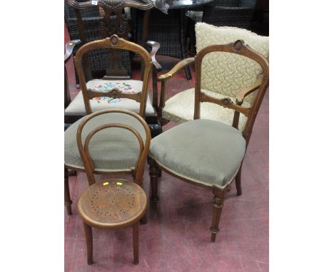 Two matching upholstered drawing room chairs, a single carver chair with floral tapestry seat, a light coloured floral uphols