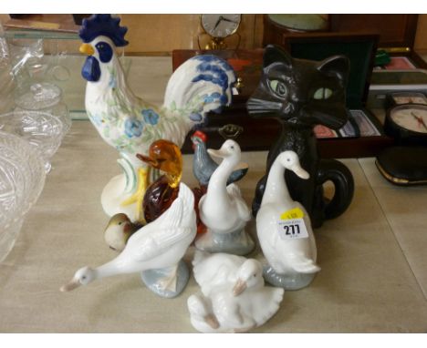 Four Nao duck and goose figurines, four further birds, various compositions and a stoneware black cat