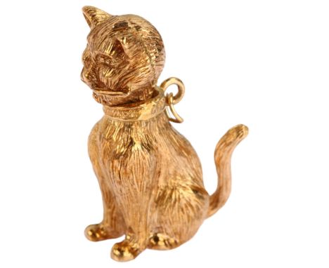 A heavy late 20th century 9ct rose gold articulated seated cat charm/pendant, maker's mark R Co, London 1972, height 31.7mm, 