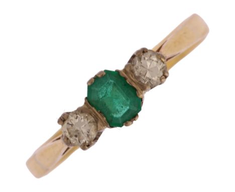 An 18ct gold three stone emerald and diamond ring, set with 0.25ct emerald step-cut emerald and round brilliant-cut diamonds,