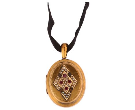 A Victorian ruby and pearl photo locket pendant, circa 1880, unmarked yellow metal settings with applied lozenge decoration w