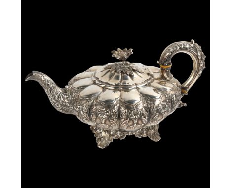 A William IV silver melon teapot, with relief embossed and chased floral decoration, flowerhead knop, scrolled acanthus leaf 