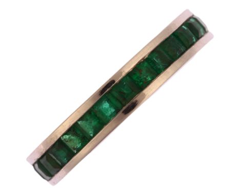 A modern 18ct white gold emerald full eternity ring, channel set with square step-cut emeralds, band width 3.7mm, size K, 3.6