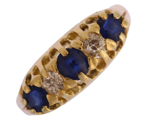 An early 20th century graduated five stone sapphire and diamond half hoop ring, unmarked 18ct gold settings, with old-cut dia