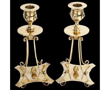 A fine pair of Victorian silver-gilt table candlesticks, each drip pan raised on shaped and twisted wirework quadruple base, 