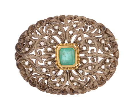 An emerald and diamond oval bombe brooch, unmarked gold and silver settings with central emerald step-cut emerald and pierced