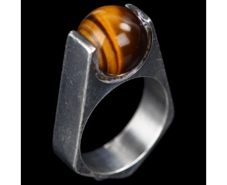 A mid-20th century Danish modernist sterling silver tigers eye orb ring, with angular shank, possibly by BRDR Bjerring of Cop