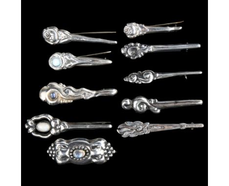10 Art Nouveau Danish silver brooches, including moonstone examples, largest length 62mmLot sold as seen unless specific item