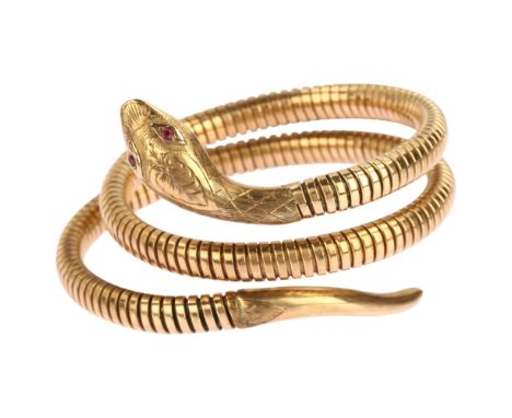 A mid-20th century 9ct gold ruby figural coiled snake bangle, with engraved head and gas-pipe body, Smith & Pepper Ltd, Chest