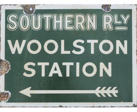 Southern Railway enamel direction sign WOOLSTON STATION with feathered arrow beneath. From the former LSWR station between So