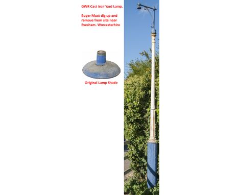 A GWR cast iron yard lamp post complete with frog and electric lamp top complete with enamel shade. The overall height above 