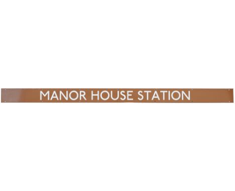 London Underground enamel station poster board sign MANOR HOUSE STATION. In excellent condition measuring 65in x 4in.