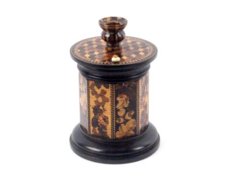 A good Tunbridge ware ebony go to bed, probably Thomas Barton, turned ebony circular base with striker, octagonal body in var