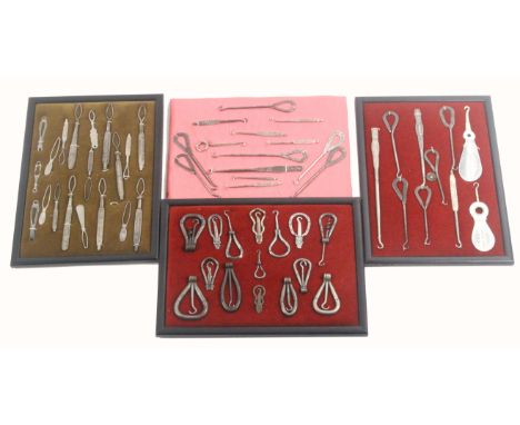 Seven mounted displays of button hooks, mostly steel advertising examples, one display of folding examples, approximately nin