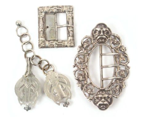 Buckles - three, comprising an oval silver example decorated with masks and leaf scrolls, Chester 1890, Cornelius Desormeaux 
