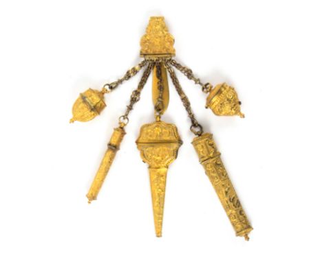 A late 18th Century gilt metal chatelaine, the mount with a basket of flowers amid leaf scrolls with five hinged multi-link c