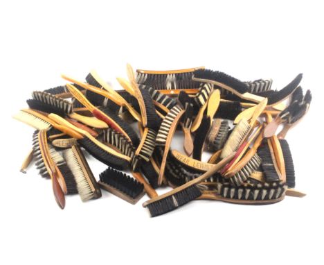 A collection of fifty two vintage brushes, incorporating retailers advertisements comprising forty four long handled hat brus