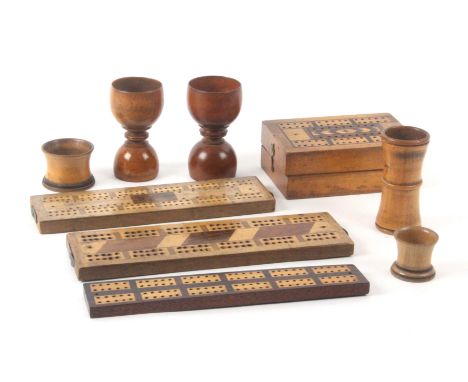 Five dice cups and four other pieces, two dice cups of double egg cup form, both 9.5cms high, another of waisted form, two sm