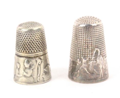 Two French silver thimbles, 'The Crane and The Fox', and another of two female figures sewing in room interior with cat, cloc