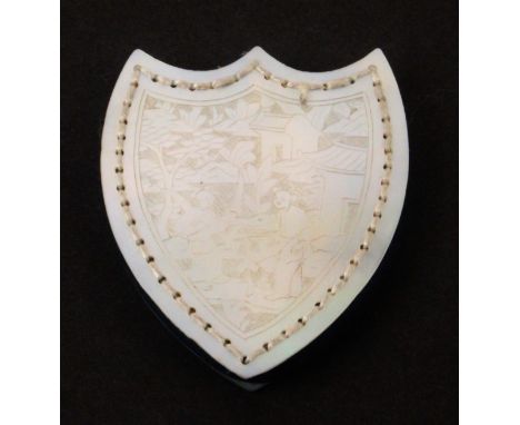 A mother of pearl Chinese export shield shaped pin cushion, with original blue velvet infill, each side carefully engraved wi