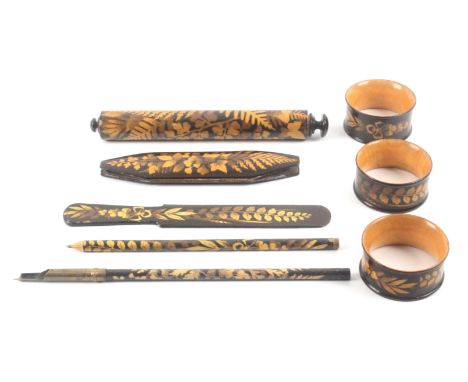 Fern ware - eight pieces, all silhouette on brown ground comprising a cylinder ruler with pencil and eraser, scale in black o