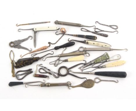 A collection of circa eighty button hooks, mostly circa 1900, including ten folding examples and a group of smaller examples,