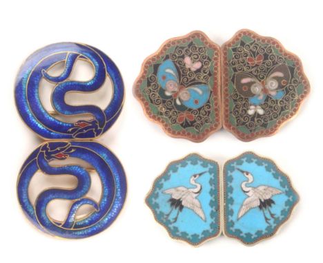 Buckles - three enamel decorated buckles, comprising a Chinese enamel example decorated with two cranes, 7.5cms, a cloisonne 