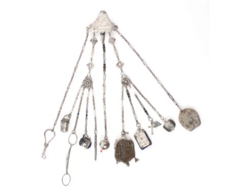 A comprehensive polished steel chatelaine, the hook mount etched with two pheasants amid foliage to five chains two subsequen